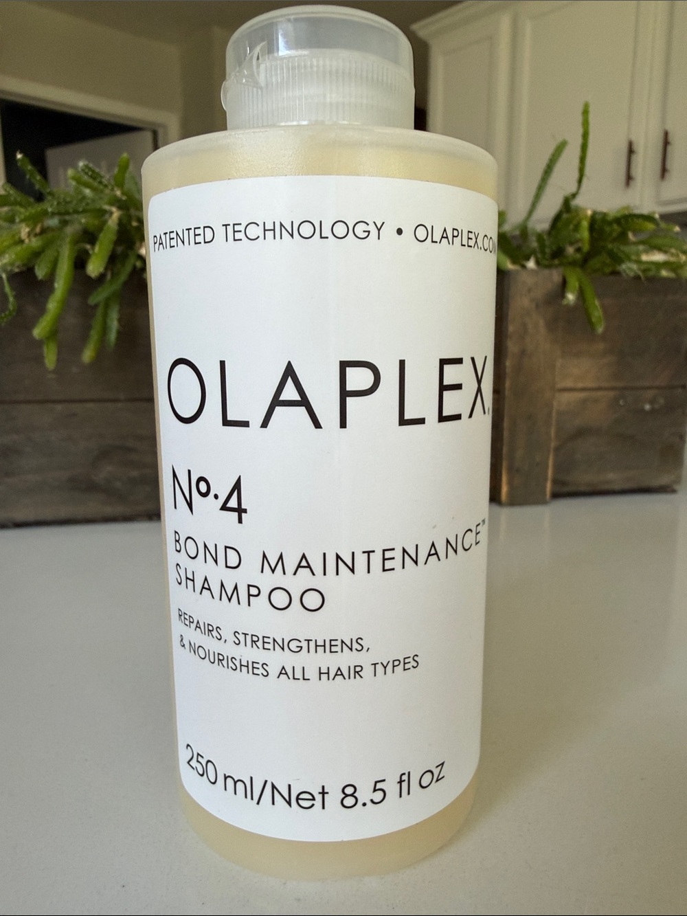 OLAPLEX No.4 Bond Maintenance Shampoo – White Bottle with Black Text